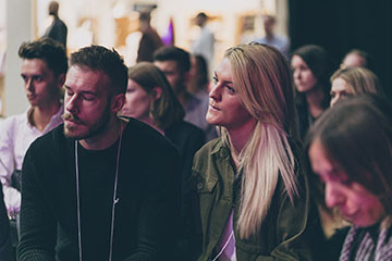 couple listening to a talk at autumn fair