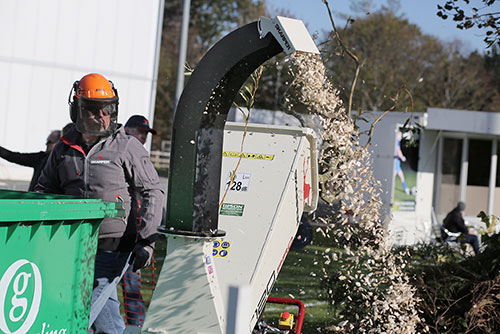 Man chopping wood at SALTEX event