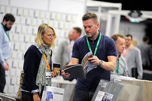 Stall holder and customer at Landscape Event
