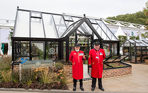 Chelsea Pensioners in front of Opus Grand Botanic Hartley Botanic Greenhouse press day