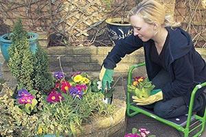 woman carrying out garden jobs